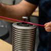 Operator uses a hot air tool with an insulon safety guard on a cable assembly