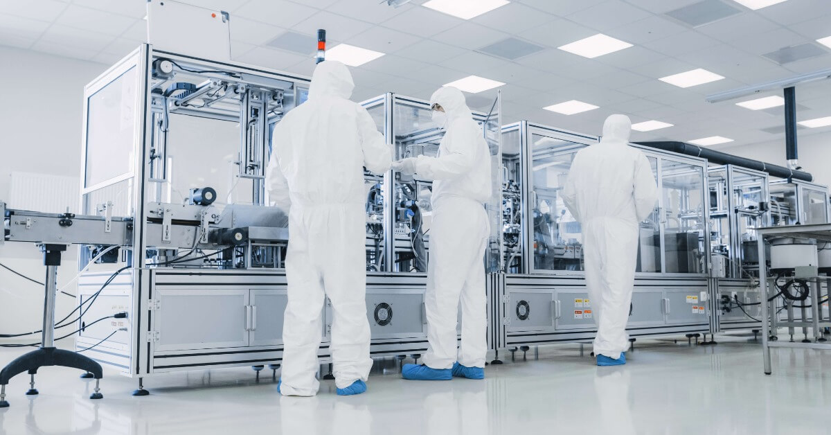 Semiconductor fabrication engineers and equipment in a cleanroom facility