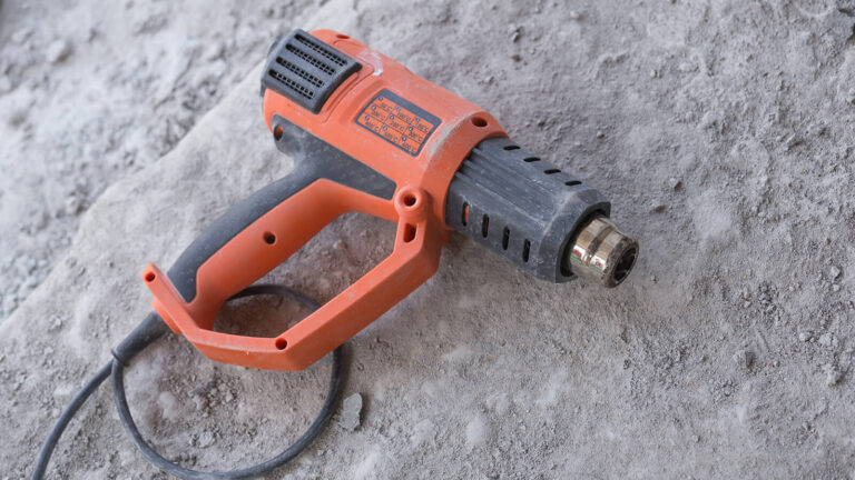 Industrial hot air tool laying on concrete