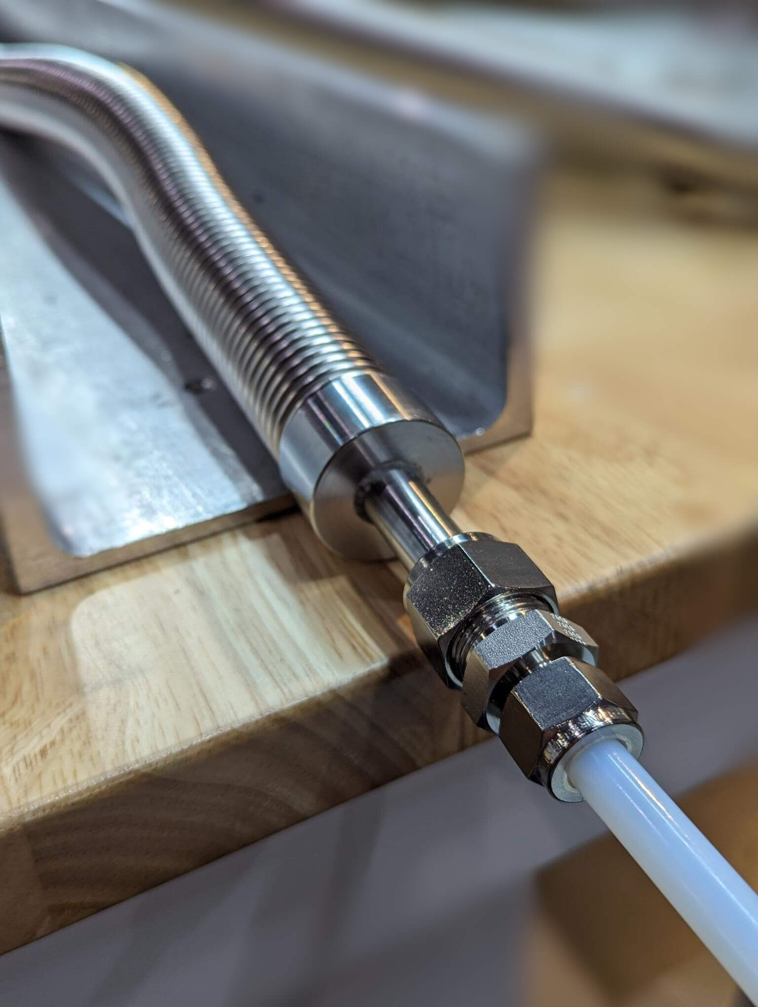 Insulated PTFE or PFA hose has smooth internal bore and non-metallic wetted surfaces